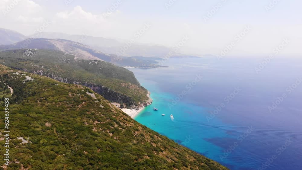 Aerial Drone View of Gjipe Beach and Canyon, Dhermi, Albania - Hidden Paraside with boats, tourists, sunbeds and blue sea Aerial Drone View of Gjipe Beach and Canyon, Dhermi, Albania - Hidden Paraside with boats, tourists, sunbeds and blue sea