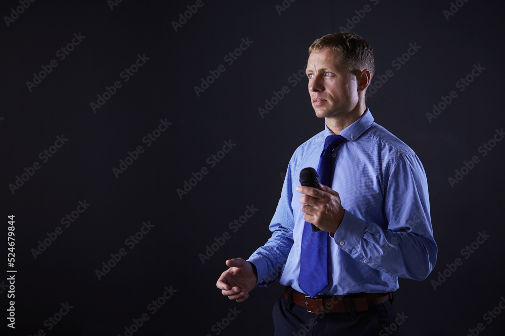 Businessman speech concept, talking with microphone in conference hall Businessman speech concept, talking with microphone in conference hall