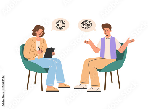 Male teenager patient talks with female psychologist.