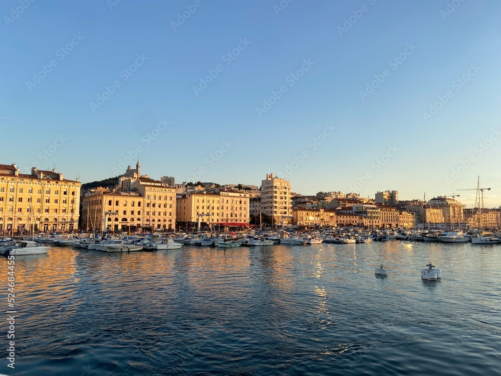 view of the vieux port of marseille at sunset
