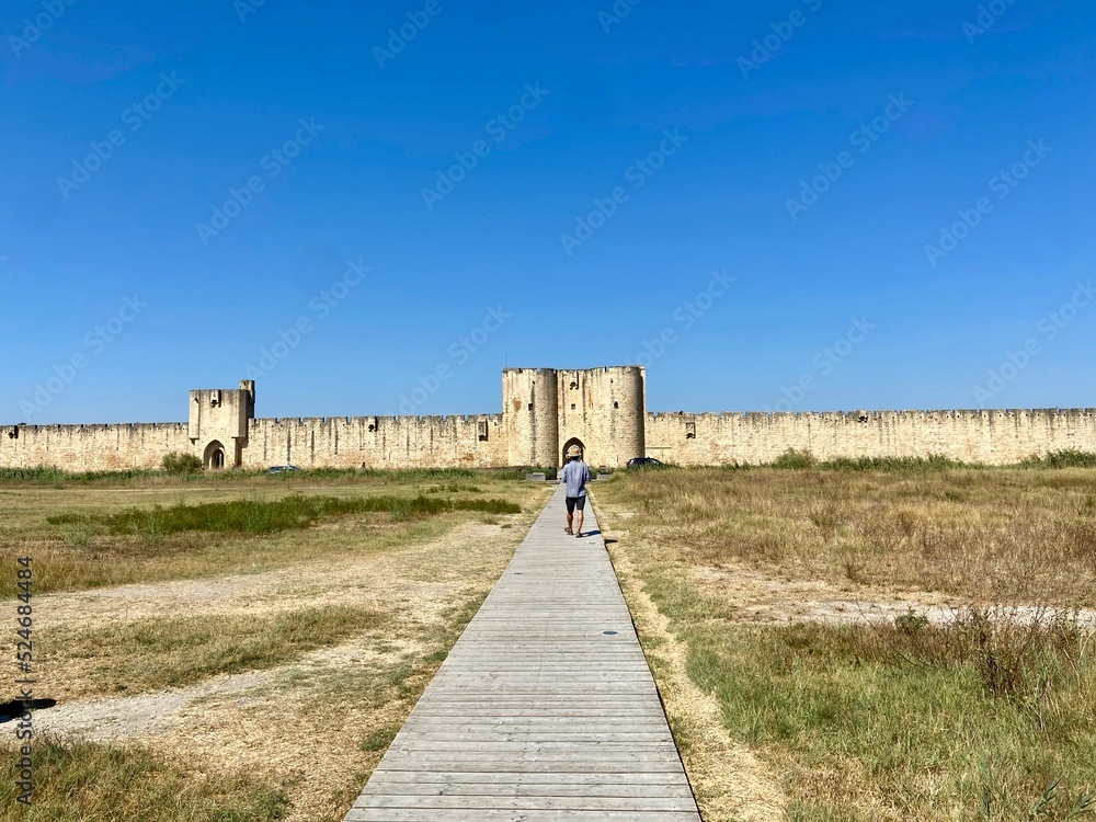 entering the fortified town of aigues mortes
