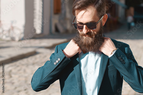 Obraz na płótnie Stylish man with beard wearing a jacket, shirt and bow tie w salonie