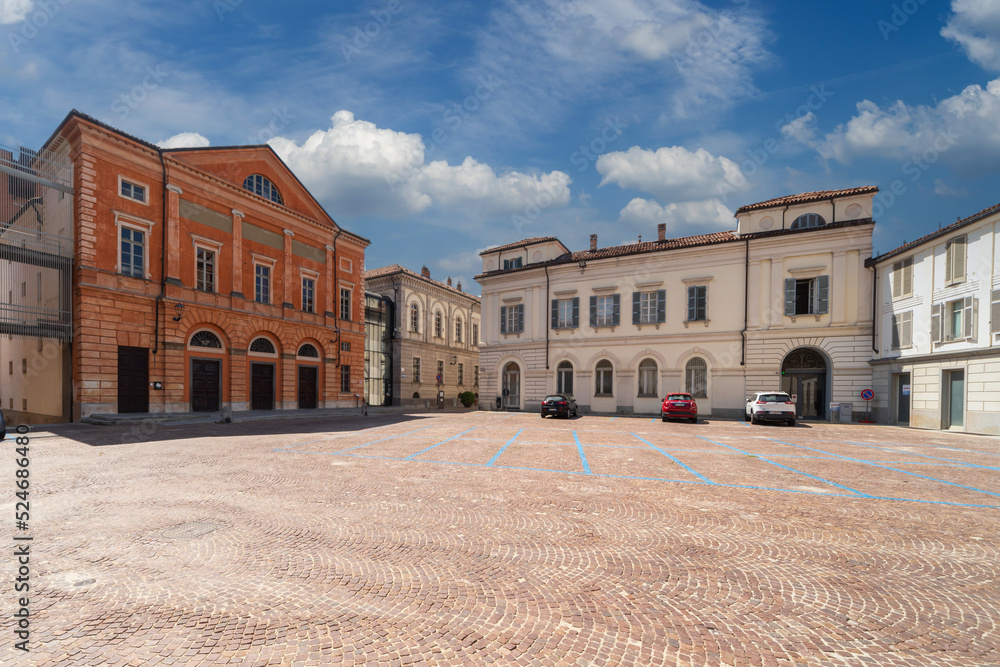 Alba, Langhe, Piedmont, Italy: Vittorio Veneto cobblestone square with the Teatro Sociale (social theater) on the left and ancient buildings