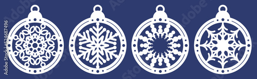 Set of laser cutting template of Christmas balls with snowflakes. Silhouette of openwork spheres with lace ornament. Xmas tree decoration for paper cut out. Vector illustration on blue background.