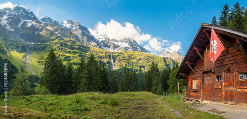 The Hineres Lauterbrunnental valley with the peaks Mittaghorn and Grosshorn and Breithorn and the typically chalet.