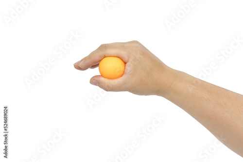 A hand holds an orange ping pong ball isolated on white background