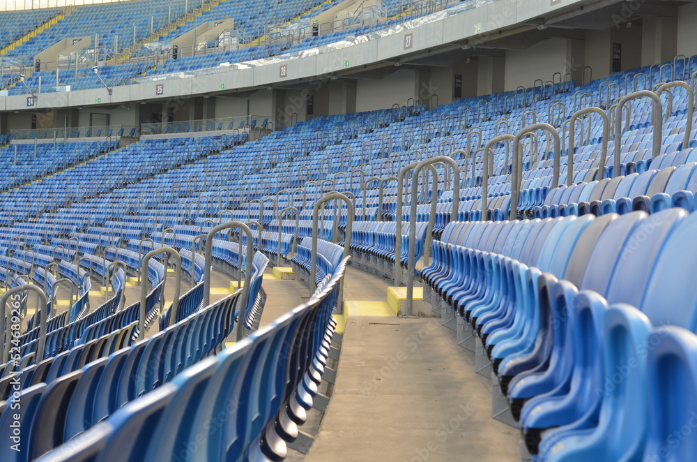 Naklejka premium the empty football stadium playground chairs