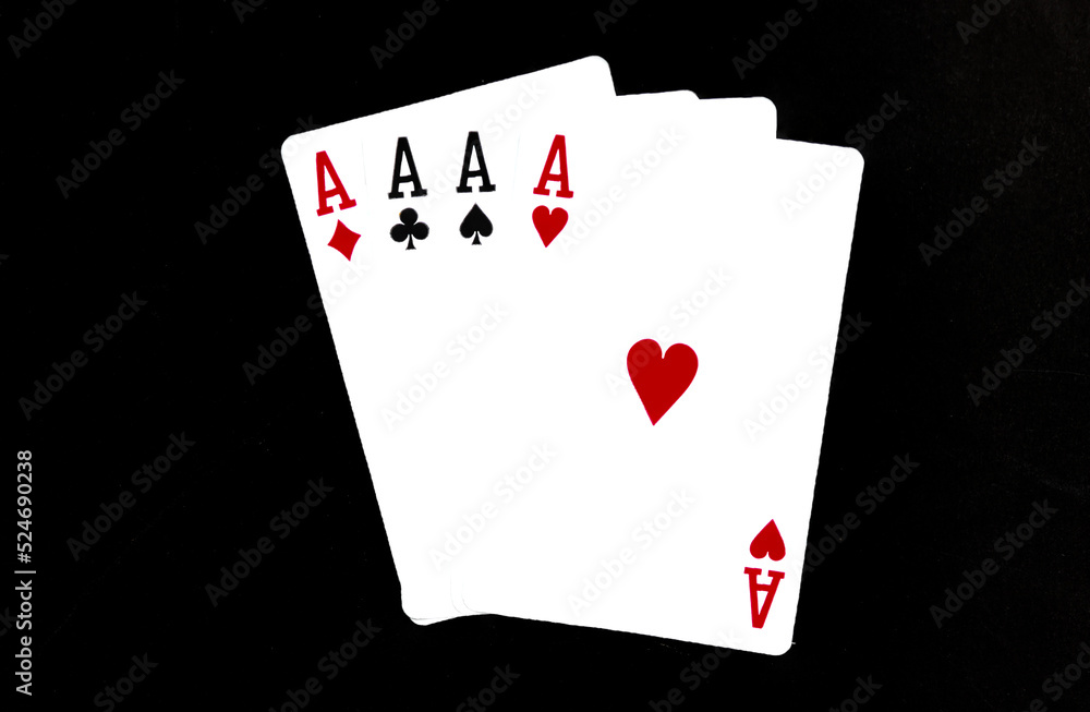 Royal playing cards on a black background.