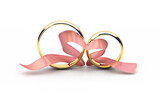Two golden wedding rings with a pink ribbon in a heart shape.
