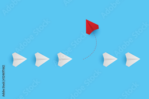 Business creative idea minimal concept. Creative paper planes on blue background. Red airplane changing direction. New idea, change, trend, courage, creative solution, innovation and unique concept.