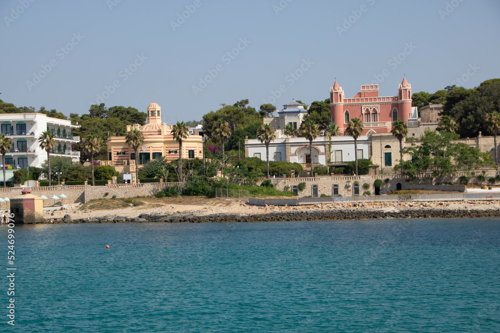 the town Santa Maria di Leuca and liberty villas and traditional bagnarole as seen from sea, Apulia region Italy the town Santa Maria di Leuca and liberty villas and traditional bagnarole as seen from sea, Apulia region Italy