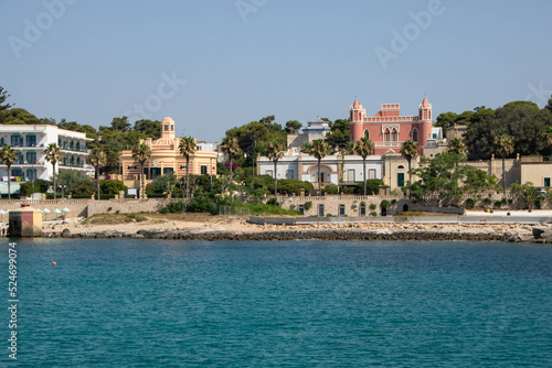 the town Santa Maria di Leuca and liberty villas and traditional bagnarole as seen from sea, Apulia region Italy