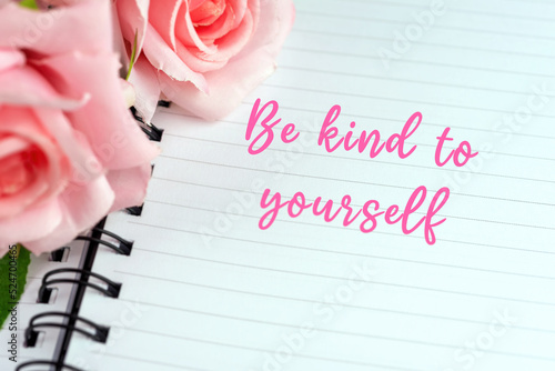 Note pad with inspirational quotes text - Be kind to yourself