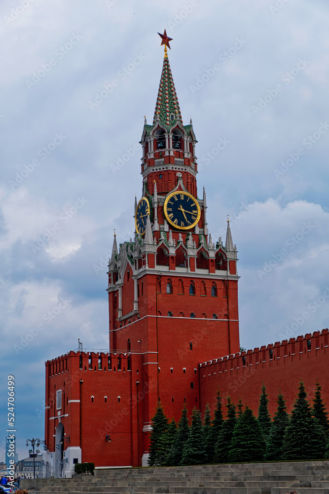 Moscow, Russia - May 20 2018: Moscow kremlin tower Spasskaya - the main tower with clock and famous ruby star atop Moscow, Russia - May 20 2018: Moscow kremlin tower Spasskaya - the main tower with clock and famous ruby star atop