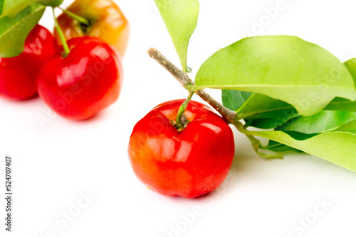Acerola Cherry or Barbados Cherry with branch and leaf isolated on white background.