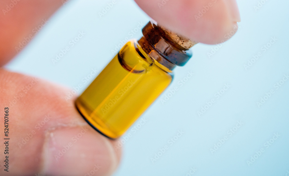 Small bottle with aromatic perfume with pheramones Small bottle with aromatic perfume with pheramones