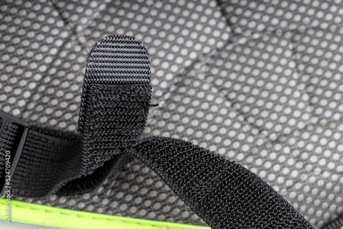 Foto black Velcro on a black tape belt. folded sticky part on the belt