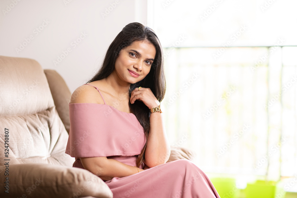 Pretty Indian young woman on sofa at home Pretty Indian young woman on sofa at home