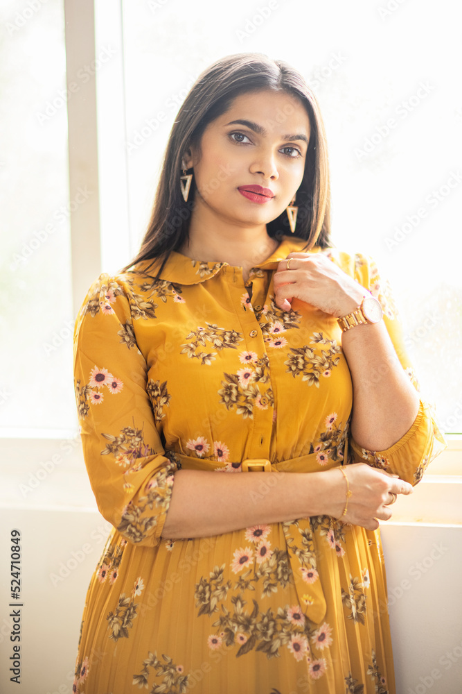 Pretty Indian young woman on sofa at home Pretty Indian young woman on sofa at home