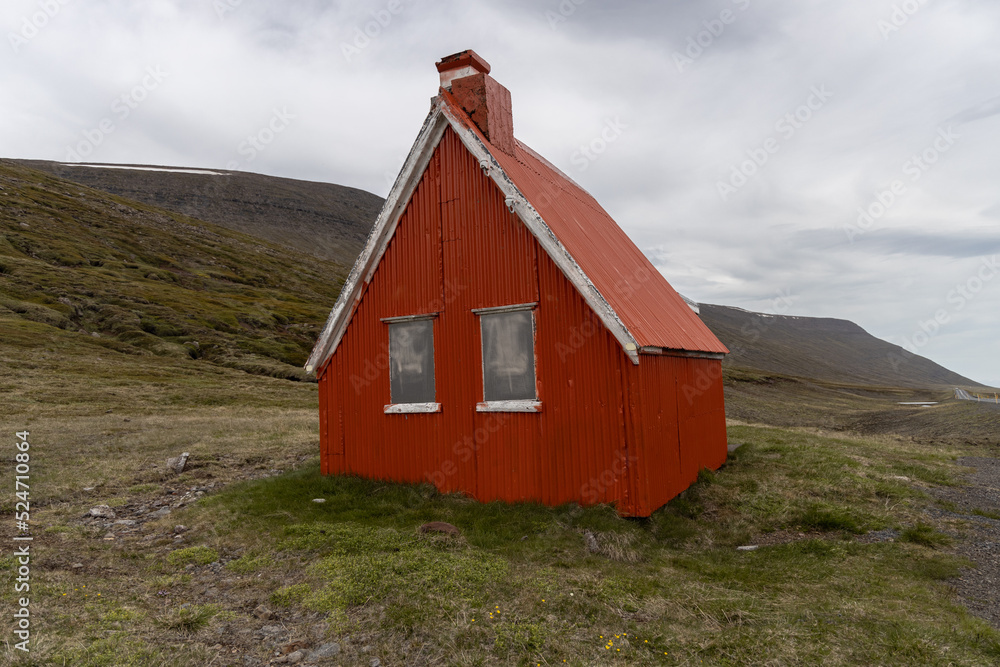 Red Barn in Iceland with clouds 