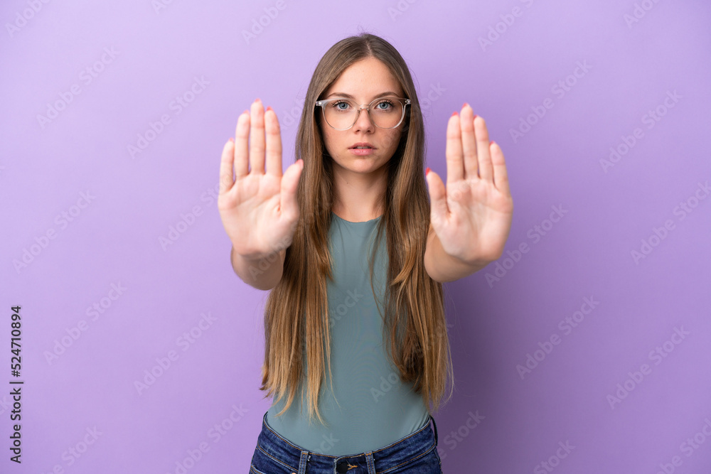 Young Lithuanian woman isolated on purple background making stop gesture and disappointed Young Lithuanian woman isolated on purple background making stop gesture and disappointed