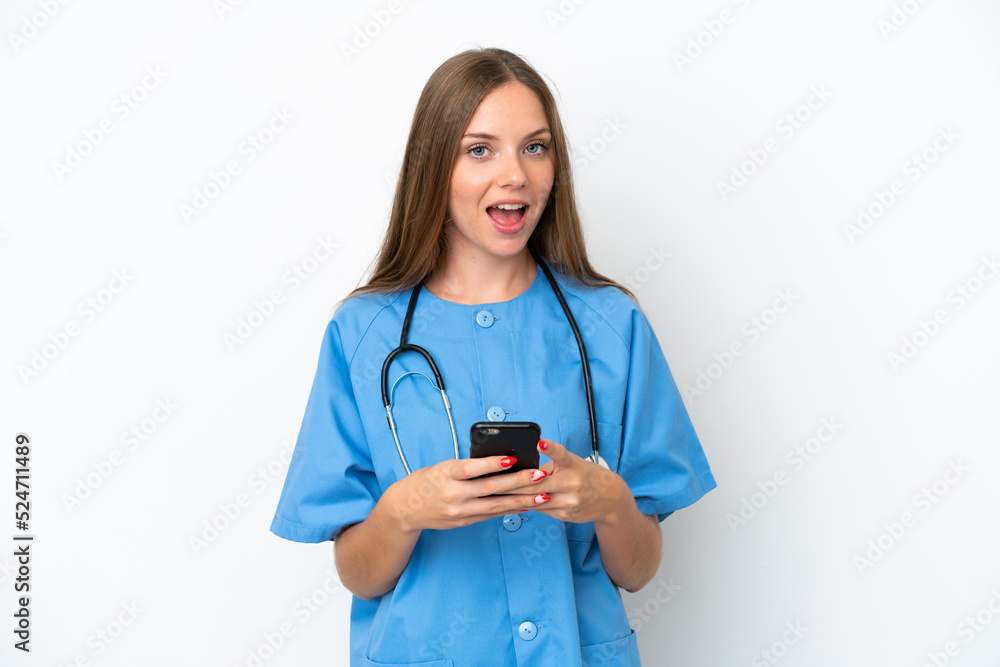 Young surgeon doctor Lithuanian woman isolated on white background surprised and sending a message