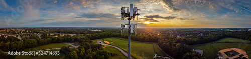 Photo Panorama of mobile cell phone transmission tower on the hill of a park in the mid west city of Lexington, KY during dramatic sunrise
