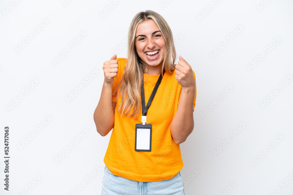 Young caucasian woman with ID card isolated on white background celebrating a victory in winner position Young caucasian woman with ID card isolated on white background celebrating a victory in winner position