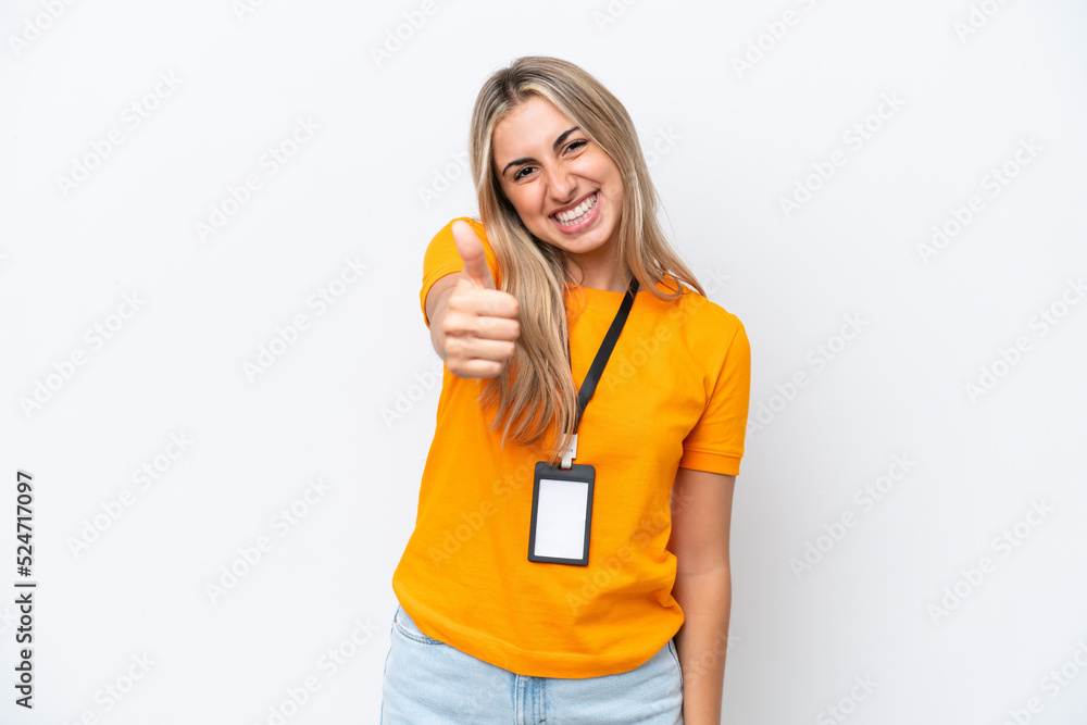 Young caucasian woman with ID card isolated on white background with thumbs up because something good has happened Young caucasian woman with ID card isolated on white background with thumbs up because something good has happened