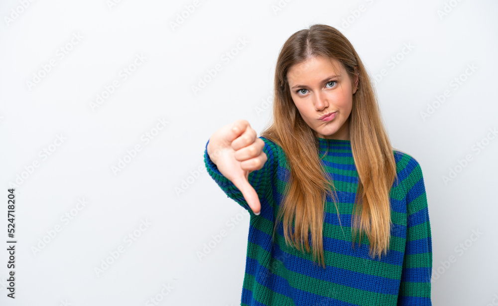 Young caucasian woman isolated on white background showing thumb down with negative expression Young caucasian woman isolated on white background showing thumb down with negative expression