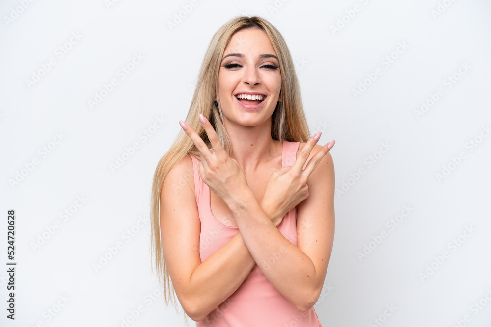 Pretty blonde woman isolated on white background smiling and showing victory sign Pretty blonde woman isolated on white background smiling and showing victory sign