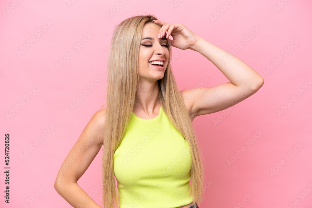 Pretty blonde woman isolated on pink background smiling a lot Pretty blonde woman isolated on pink background smiling a lot