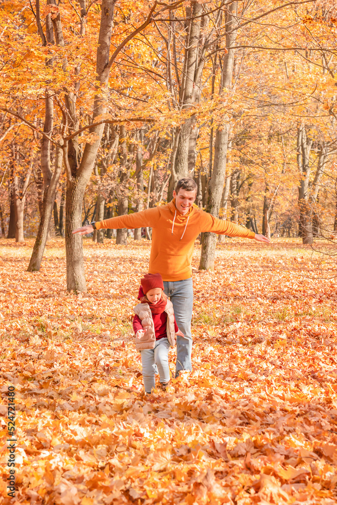 Happy father and daughter having fun in autumn park. Happy father and child daughter on autumn walk. Happy father and daughter having fun in autumn park. Happy father and child daughter on autumn walk.