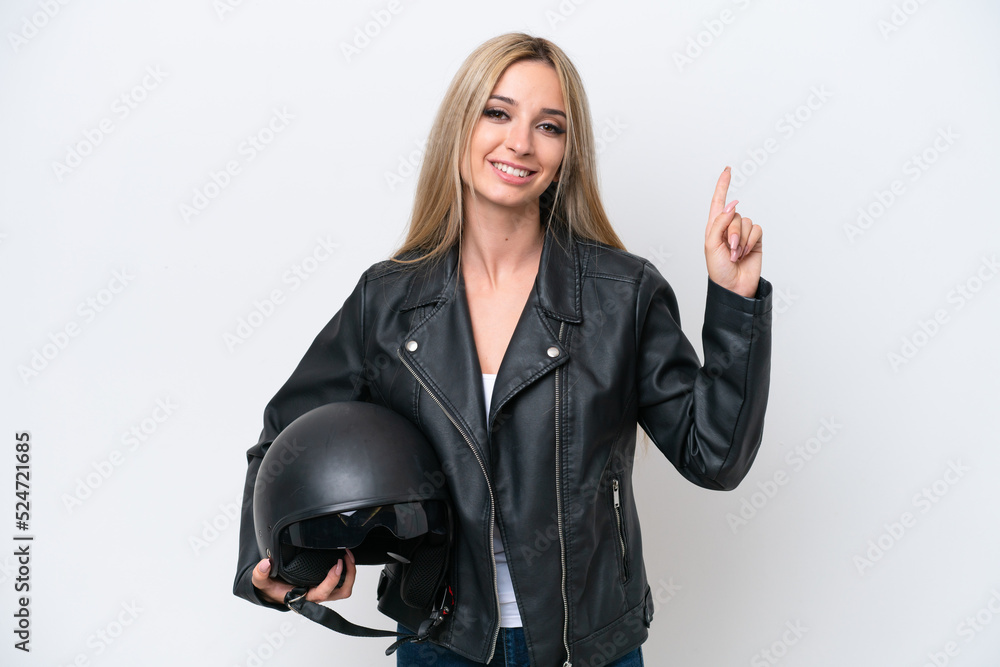Pretty blonde woman with a motorcycle helmet isolated on white background showing and lifting a finger in sign of the best Pretty blonde woman with a motorcycle helmet isolated on white background showing and lifting a finger in sign of the best