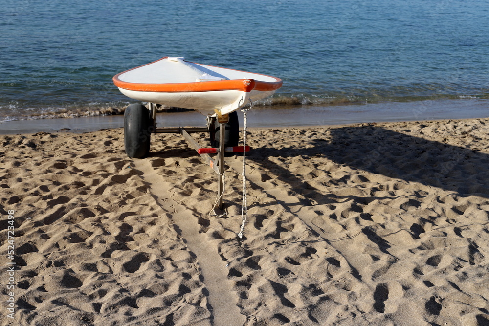 Naklejka premium Lifeguard boat on the city beach.