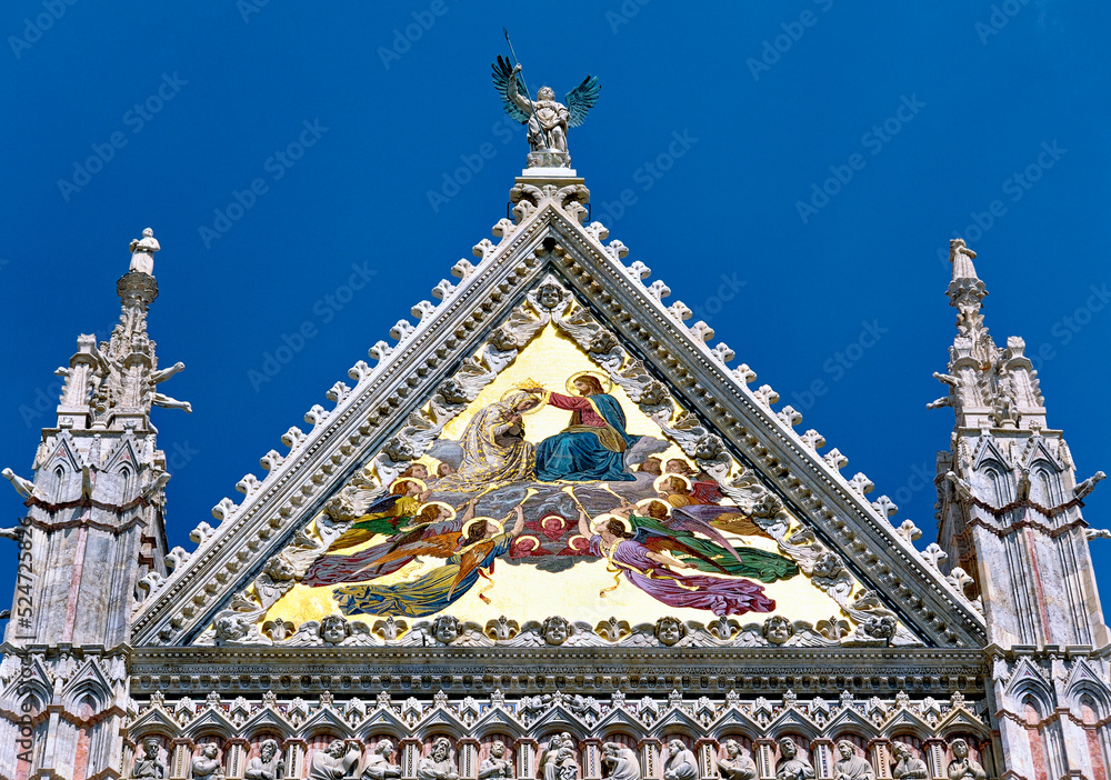 Tympanum on the main façade of Sienna Cathedral, Tuscany, Italy