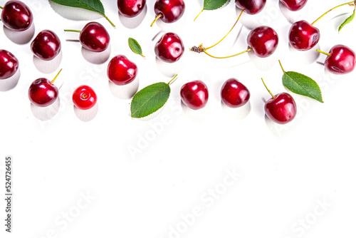 Cherry with leaf isolated on white.