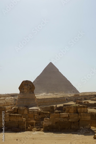 The view of Great Sphinx of Giza with pyramid in background