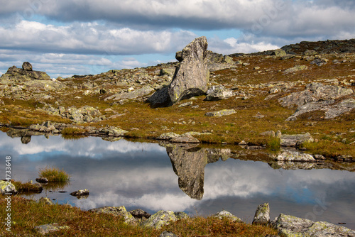 Huge rocks along Kungsleden hiking trail between Serve and Aigert mountain huts, Lapland, Sweden photo