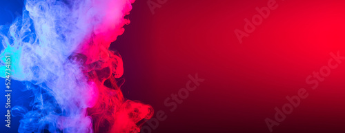 Banner smoke vape or e-cigarette in neon light at black background copy space © satura_
