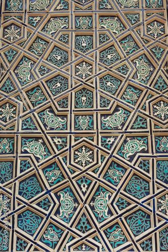 national patterns in the architecture of uzbekistan. photograph of a wall in a Tashkent mosque. national wall decoration with blue tiles in uzbekistan photo