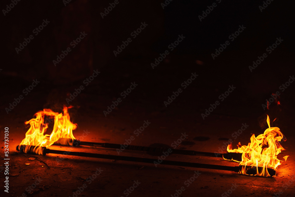 orange fire from an iron torch. Burning kerosene on a cane rag. burning ...