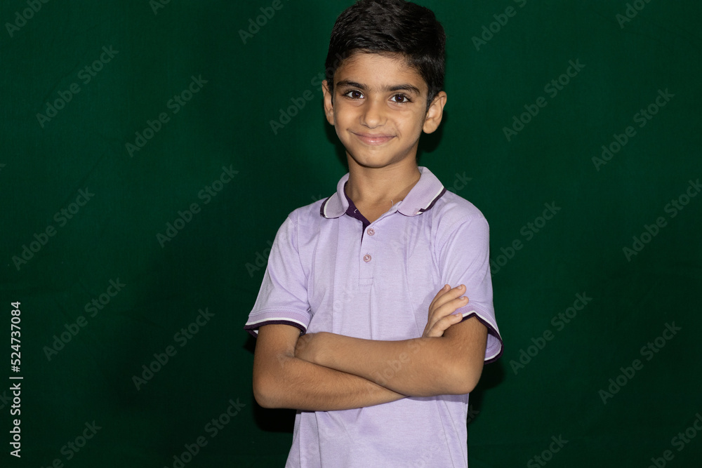 portrait of a handsome boy with green background