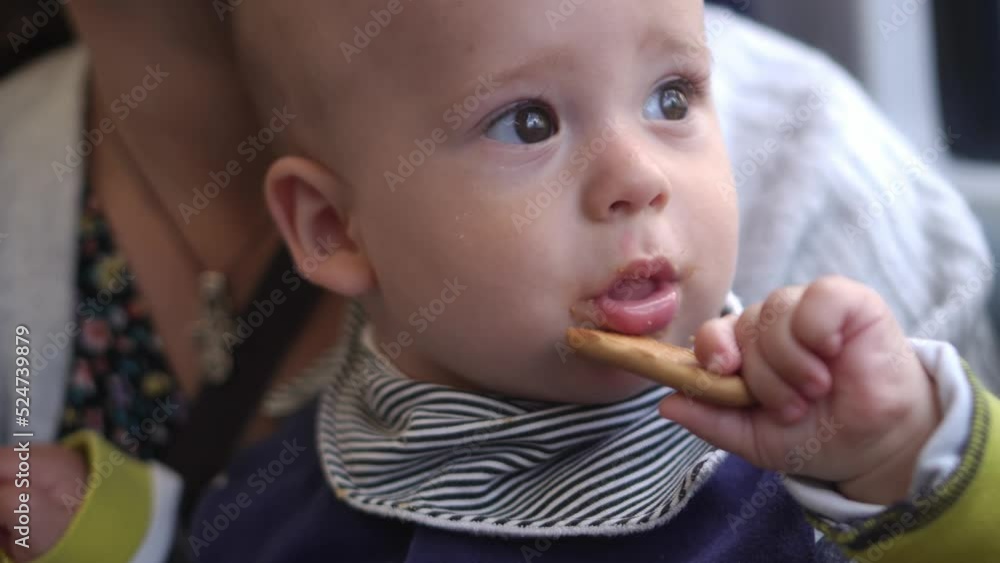 Baby snack time. Happy Mom traveling by train with her Son. Mother and child. Traveling with children. traveling the world Infant rides rain, looks out the window, enjoying the scenery. Paternhood Baby snack time. Happy Mom traveling by train with her Son. Mother and child. Traveling with children. traveling the world Infant rides rain, looks out the window, enjoying the scenery. Paternhood