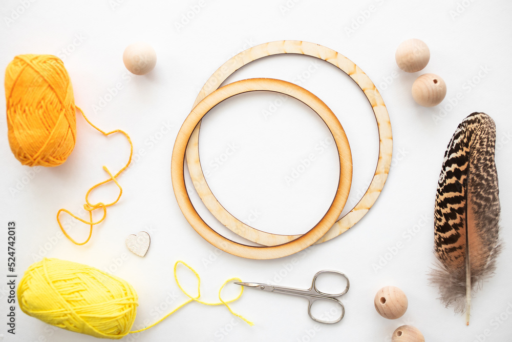Wooden ring, deads, feather for makink dreamcatcher. Masterclass of weaving a dream catcher. Wooden ring, deads, feather for makink dreamcatcher. Masterclass of weaving a dream catcher.