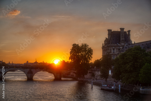 View of the famous bridge called Pont Royal and the Louvre Museum at sunset, Paris