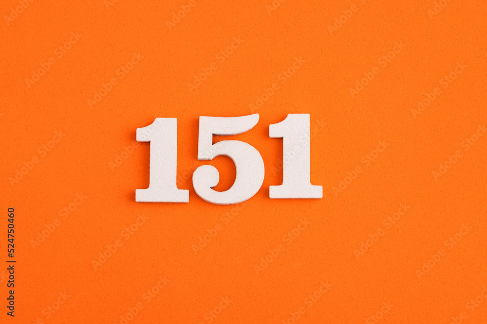 White wooden number 151 on eva rubber orange background White wooden number 151 on eva rubber orange background
