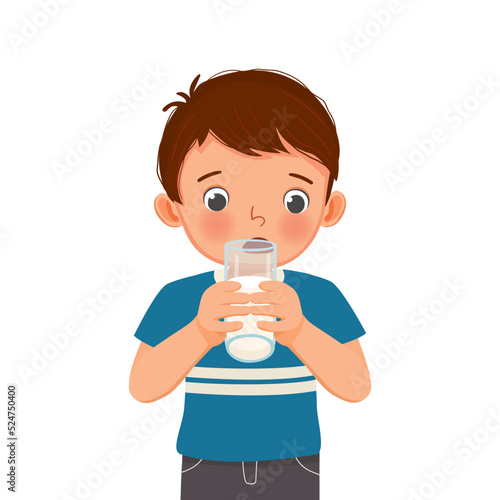 cute little boy drinking a glass of milk 
