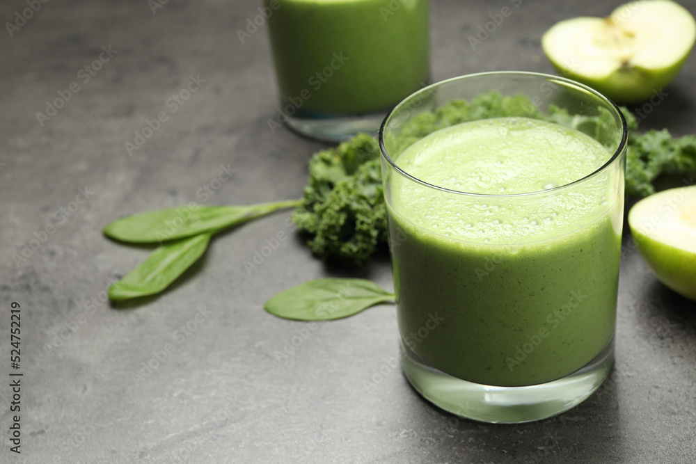 Tasty fresh kale smoothie on grey table, closeup Tasty fresh kale smoothie on grey table, closeup
