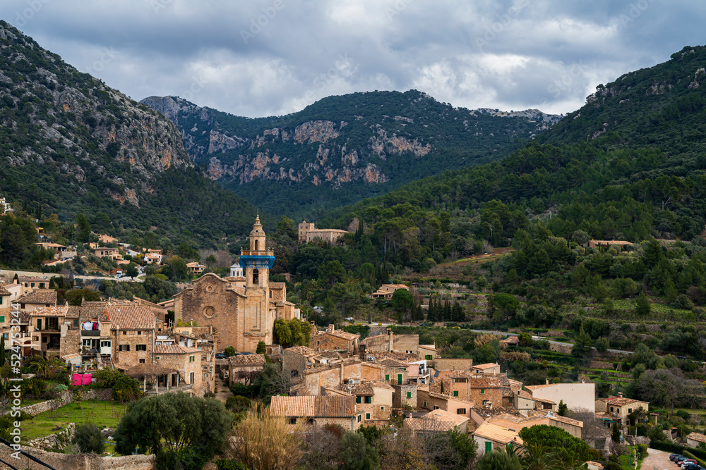 Panoramic view of the town of Valldemossa between the mountains. Photograph taken in Valldemossa, Majorca, Spain.